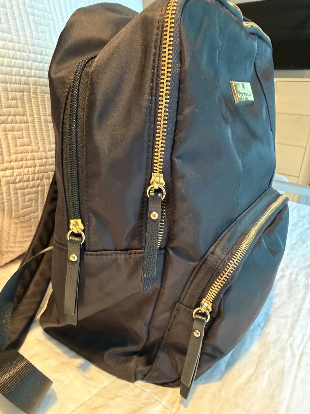 Allancia Black Nylon Backpack with Gold Accent Plaque